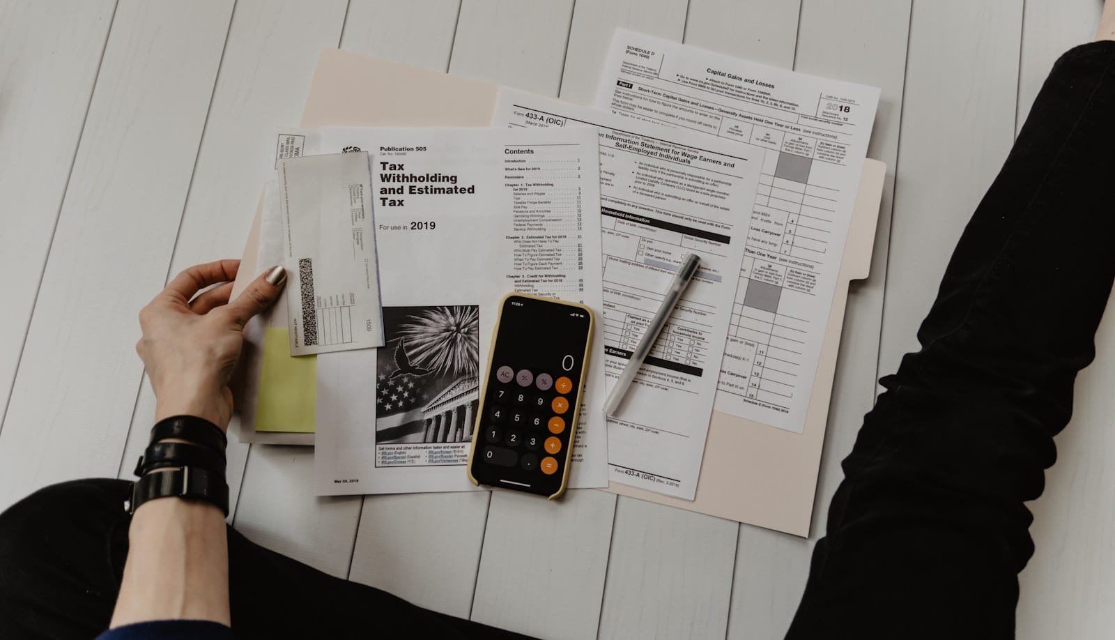Calculator and financial documents on a desk