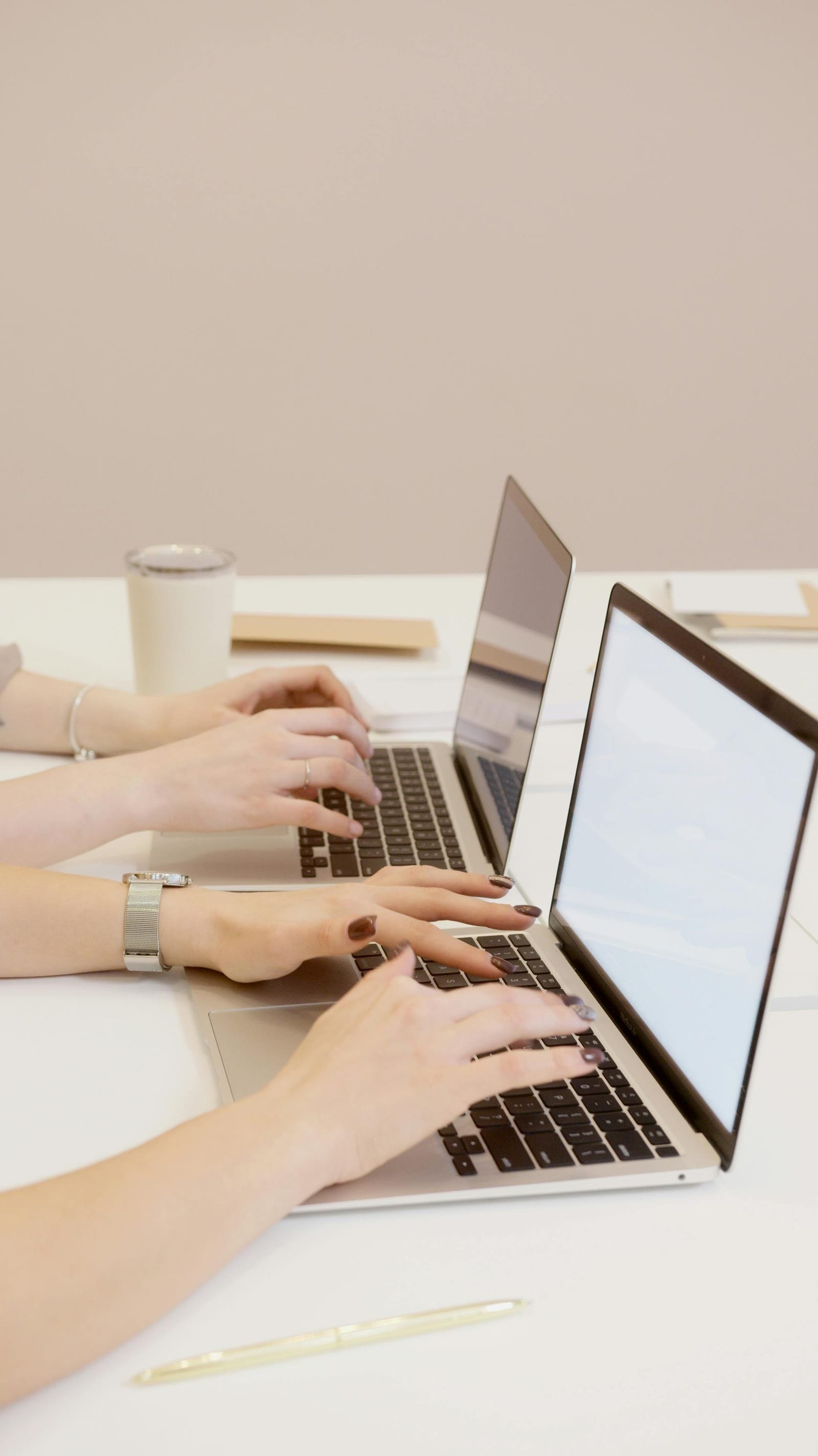 Team working on laptops at a desk